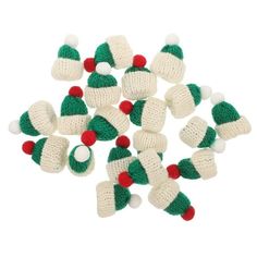 knitted christmas hats and mittens are arranged in the shape of santa's hat