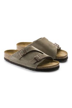 cMake comfort and style a priority with these Birkenstock Zurick Suede Sandals for Women in Taupe. Featuring extra coverage and adjustablility from two metal pin buckles. Velvety soft suede lends a classic feel to the upper, above a supportive contoured footbed. Features: Birkenstock Style: 50463 Color: Taupe Classic suede upper Suede footbed lining helps keep you comfortable EVA sole is flexible and lightweight Single strap with two adjustable metal pin buckles Birkenstock branded logo on inner Comfortable Suede Sandals With Buckle Closure, Classic Suede Sandals For Spring, Casual Suede Sandals With Buckle Closure, Classic Suede Sandals With Leather Footbed, Casual Open Toe Footbed Sandals With Suede Lining, Classic Suede Sandals With Textured Footbed, Classic Suede Sandals, Classic Suede Footbed Sandals With Removable Insole, Classic Suede Footbed Sandals With Round Toe