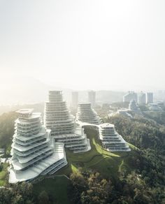 an aerial view of a building in the middle of trees