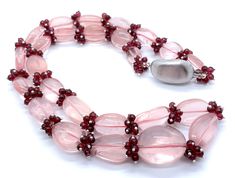 100 % Natural ROSE QUARTZ smooth tumble & Natural RED GARNET smooth round ball shape beaded necklace with 925 Sterling Silver clasp and wires. Details: - Gemstone - Rose Quartz & Red Garnet Shape - Tumble & Round Strand - 1 Calibration - Rose Quartz From 12x15x4MM till 20x26x16MM & Red Garnet 4MM Weight of necklace - 682.00 Carats ( 136.40 Grams ) Length of necklace - 24.50 Inches Each bead is drilled with 1MM diameter hole SKU - HJHOOK0090 100 % NATURAL ROSE QUARTZ SMOOTH TUMBLE BEADS USED  100% NATURAL RED GARNET SMOOTH ROUND BEADS USED 925 STERLING SILVER ITALIAN TUMBLE SHAPE CLASP USED 925 STERLING SILVER WIRES USED UNBREAKABLE THREAD USED READY TO WEAR NECKLACE VERY RARE NECKLACE OF ROSE QUARTZ & RED GARNET PARTY WEAR NECKLACE AMAZING NECKLACE VERY NICE-LOOKING NECKLACE Thank you for Luxury Formal Gemstone Beads Necklace, Elegant Single Strand Round Beads, Pink Gemstone Accents Necklaces For Formal Occasions, Formal Pink Necklaces With Gemstone Accents, Formal Pink Gemstone Accented Necklaces, Luxury Round Gemstone Beaded Necklaces, Luxury Gemstone Beads And Cabochons For Gift, Luxury Round Gemstone Bead Necklaces, Luxury Pink Briolette Necklace