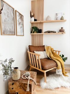 a living room filled with furniture and decor on top of a hard wood floored floor