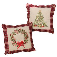 two pillows with christmas decorations on them, one has a wreath and the other has a bow