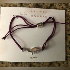 Lc Lauren Conrad Roar Bracelet Adjustable Size Purple With Silver Dinosaur New With Tags Picture Reflects Condition Will Consider All Offers Dinosaur Bracelet, Lauren Conrad Jewelry, Lc Lauren Conrad, Lauren Conrad, Womens Jewelry Bracelets, Color Purple, Women Jewelry, Bracelet, Tags