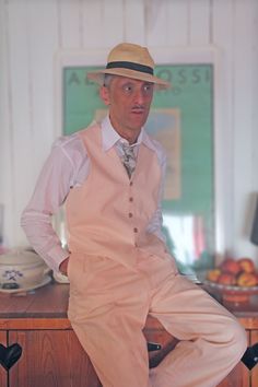 Step back in time with these vintage-inspired pink linen trousers, meticulously crafted to exude the charm of the 1920s and 1930s. Made from high-quality linen, these trousers boast both style and comfort, perfect for the modern gentleman with a penchant for the classics. The high-waisted design pays homage to the elegant fashion of the roaring twenties, while the pleated front adds a touch of sophistication and refinement. Whether you're strolling through the city streets or attending a Gatsby-esque soirée, these trousers are sure to make a statement. Embrace nostalgia and add a timeless piece to your wardrobe with these vintage-style trousers. Pair them with a crisp white shirt and suspenders for a truly dapper look, or mix and match with contemporary pieces for a unique twist on classic Classic Pink Summer Bottoms, Fitted Vintage Linen Bottoms, Vintage Fitted Pink Pants, Vintage Pink Fitted Pants, Vintage Pink Pants For Summer, Pink Linen Trousers, The Roaring Twenties, Spring Outfits Men, High Waist Trousers