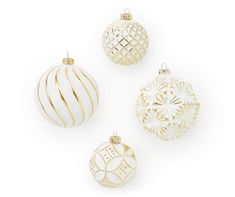 four white and gold christmas ornaments against a white background