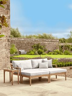 a couch and two tables on a patio