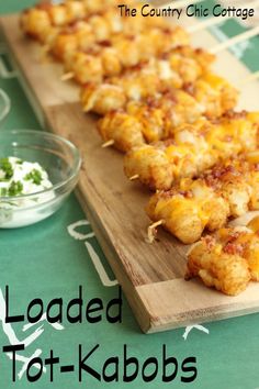 loaded tot - kabobs on a cutting board with ranch dressing in the background