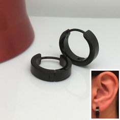 Mens large hoop earrings in a half matte finish. These black hoops are made from stainless steel. Sold as a pair or single earring.  SPECIFICATION Minimalist Black Small Hoop Huggie Earrings, Black Minimalist Small Hoop Earrings, Small Black Hypoallergenic Hoop Earrings, Hypoallergenic Small Black Hoop Earrings, Minimalist Black Stainless Steel Hoop Earrings, Black Hypoallergenic Hoop Earrings In Stainless Steel, Modern Black Hypoallergenic Hoop Earrings, Black Stainless Steel Hoop Earrings As Gift, Black Stainless Steel Hoop Earrings