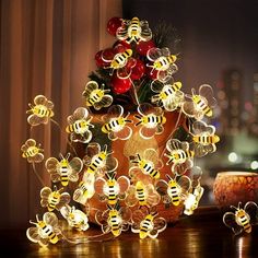 a vase filled with lots of bees sitting on top of a table