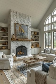 a living room filled with furniture and a fire place in front of a large window