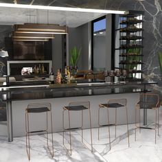 a modern kitchen with marble counter tops and bar stools