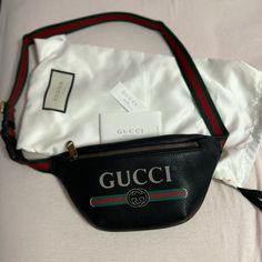 New Never Used. The Strap Is 14”(The Longest). Gucci Black Belt Bag. 5.5” L (Bottom) X 5” H (Upper The Zip). Comes With Original Dust Bag. Gucci Shoulder Bag With Logo Hardware For Business, Gucci Rectangular Bag With Logo Hardware, Rectangular Gucci Bag With Logo Hardware, Black Gucci Shoulder Bag With Logo Hardware, Gucci Crossbody Bag With Logo, Luxury Bags With Designer Logo, Luxury Designer Logo Bags For Daily Use, Black Gucci Shoulder Bag With Logo, Modern Gucci Bag With Logo Hardware