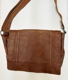 VTG Fossil Leather Briefcase Messenger Shoulder Bag Laptop Crossbody Brown Large.  Stunning large multi pocket multi purpose bag.  Great looking plaid fabric lining.  Adjustable leather strap.  Measures approximately 15" wide x 14" tall x 4"+ depth.  Original condition with no cleaners, chemicals or polishes used. We leave that to the buyer who may have product preferences or prefer original.  Measurements and colors are approximate and as close as possible.  Please examine the photos for additional details and conditions which are part of the disclosure.  All items sell As Is and we do no accept returns so please ask any questions prior to purchase.  Thank you for looking Multipurpose Bag, Laptop Briefcase, Plaid Fabric, Leather Briefcase, Leather Messenger, Messenger Bags, Fort Lauderdale, Fossil, Leather Straps