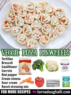 a white plate topped with mini pizzas next to broccoli and cauliflower