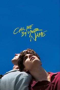 two young men looking up at the sky with graffiti written on their foreheads that says call me by your name