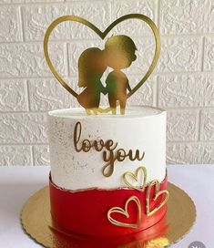 a wedding cake decorated with two people holding hands and the words love you on top