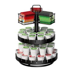 a three tiered tray with cups and baskets on the top, in front of a white background