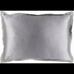 a silver pillow on a white background