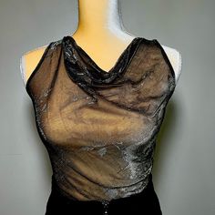 Relive The 90’s Authentically With This Dee Izmail Sheer Drape Neck Blouse. This Item Is From Celebrity Designer Dee Izmail’s Archives From Her Flagship Store In London ! Dee Is Known For Dressing The Spice Girls, Cher And Shania Twain. Edgy Sheer Top For Party, Edgy Sheer Top For Evening, Edgy Sheer Tops For Evening, Edgy Sleeveless Top For Evening, Vintage Black Top For Party, Vintage Black Tops For Party, Vintage Black Top For Night Out, Vintage Black Tops For Night Out, Vintage Sheer Sleeveless Tops