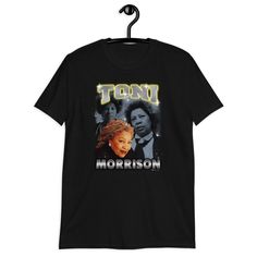 Toni! Toni! Toni!  Pay homage to Toni Morrison, the acclaimed novelist, essayist, book editor, and college professor and show that 'You Are Your Best Thing' with this 90s rap-inspired vintage graphic tee. Morrison is widely recognized for her novels, The Bluest Eye, The critically acclaimed Song of Solomon, and the Pulitzer Prize-winning Beloved. She was awarded the Nobel Prize in Literature in 1993. ● 100% ring-spun durable cotton  ● Fabric weight: 4.5 oz/y² (153 g/m²)  ● Pre-shrunk for extra durability  ● Regular fit  ● Tubular construction  ● double-stitched neckline and sleeves.  ● Shoulder-to-shoulder taping  ● Quarter-turned to avoid crease down the center INCREDIBLY SOFT - This unisex soft-style tee is noted for being one of the softest on the market. It is super comfortable, feels Rap T Shirt, Rap Shirt, 90s Rap, Toni Morrison, Rap Tee, Rap Music, Vintage Inspired Design, Vintage Tees, Fashion Tees