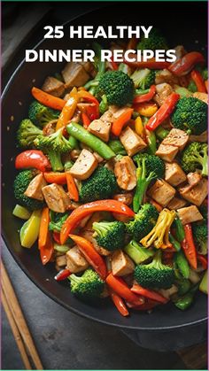 broccoli, peppers and chicken in a skillet with chopsticks