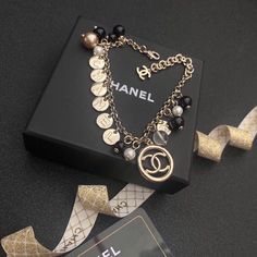 SHOP MORE LUXURY PRODUCTS HERE Description Chanel Necklace Size: Mini Chanle logo Includes box, dust bag.This product is of the premium quality. Classic Black Jewelry With Logo Charm, Luxury Jewelry Gift With Logo Charm, Luxury Black Necklace With Logo Charm, Luxury Logo Charm Jewelry For Gift, Luxury Bracelets With Logo Charm As Gift, Elegant Black Jewelry With Logo Charm, Designer Gold Jewelry With Logo, Luxury Jewelry Gift In Original Box, Luxury Jewelry Gift With Original Box