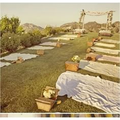 an outdoor ceremony set up in the grass