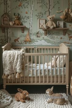 a baby crib with two stuffed animals in front of the crib and wallpaper