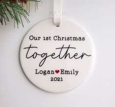 a personalized ornament for christmas is hanging on a tree