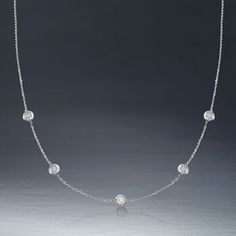 Ross-Simons - 1.00ct t. w. Bezel-Set Diamond Station Necklace in 14kt White Gold. 18". The classic look of a bezel-set diamond station necklace. Our must-have design is always in style - any outfit, any occasion. Totaling 1.00 carat, five round brilliant-cut diamonds spark a 14kt white gold cable chain. This is the piece you've been seeking to complete your collection. Lobster clasp, diamond station necklace. Diamond birthstones are the perfect gift for April birthdays. Classic Cubic Zirconia Station Necklace For Anniversary, Diamond Bezel Setting White Gold Station Necklace, White Gold Diamond Station Necklace With Bezel Setting, Luxury Diamond Station Necklace With Bezel Setting, Luxury Round Station Necklace With Bezel Setting, Luxury Round Station Necklace With Single Cut Diamonds, White Gold Brilliant Cut Round Station Necklace, Luxury Station Necklace With Single Cut Diamonds, Formal Round Station Necklace With Bezel Setting