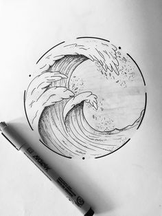 a drawing of a wave in the middle of a paper with a marker pen next to it