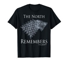 a black t - shirt with the words, the north remembers and a white wolf on it