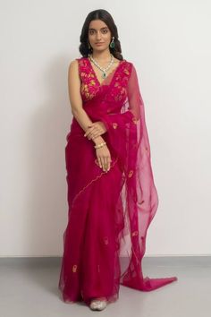 Rani pink silk organza saree with floral and sequins placement hand embroidery. Comes with a blouse. Components: 2 Pattern: Hand embroidered Type Of Work: Floral, Sequins Neckline: Deep V Neck Sleeve Type: Sleeveless Fabric: Silk organza Color: Pink Other Details:  Disclaimer : The product will dispose off some color, since it is hand dyed. Occasion: Wedding - Aza Fashions Organza Pattu Sarees, Hot Pink Saree, Rani Pink Saree, Pink Organza Saree, Weddings 2024, Unique Sarees, Sleeveless Blouse Designs, Simple Saree Designs, Rani Pink