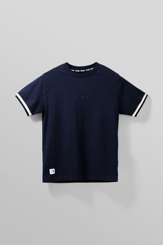 STRIPE RIB TEE - Team Liquid Navy Crew Neck T-shirt For Streetwear, Navy Short Sleeve Tops With Ribbed Collar, Navy Short Sleeve Top With Ribbed Collar, Navy Collegiate Top For Streetwear, Navy Sporty Top With Three Stripes, Collegiate Navy Top For Game Day, Collegiate Tops With Contrast Stripes For College, Navy Collegiate Top For College, Blue Casual T-shirt With Ribbed Collar