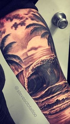 a man's arm with palm trees and waves on it