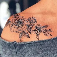 a woman's shoulder with roses on it