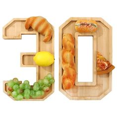 the letter c is made up of food items such as bread, grapes, lemons and croissants