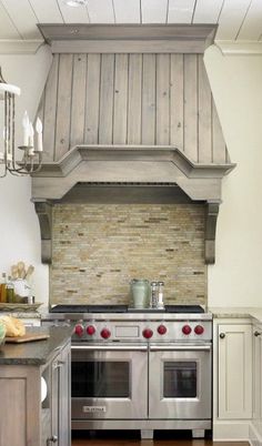 a stove top oven sitting inside of a kitchen