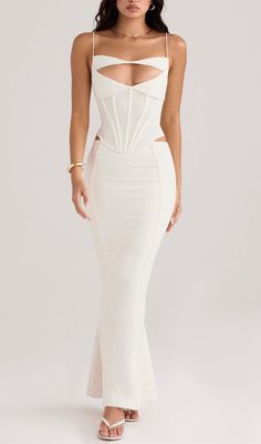 CORSET MAXI DRESS IN WHITECORSET MAXI DRESS IN WHITEBe the Epitome of Elegance and GraceIntroducing our stunning Corset Maxi Dress in White - a dress that exudes sophistication and allure. Designed to enhance your natural curves, this dress will make you feel like the most beautiful woman in the room.Unleash Your Inner ConfidenceThe waist-in design of this dress accentuates your figure, giving you an hourglass shape that will turn heads wherever you go. The pure white color adds a touch of intelligence and sophistication, making you stand out from the crowd.Perfect for Any OccasionWhether you're attending a romantic dinner date, sipping champagne with the girls, hitting up cocktail bars, or partying the night away, this dress is the perfect choice for any special occasion.Key Features: Mad Berta Dress, Corset Maxi Dress, The Most Beautiful Woman, White Corset, Beautiful Figure, Plus Size Shopping, Plus Dresses, Ruched Dress, Corset Dress