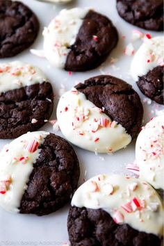 chocolate cookies with white frosting and candy canes