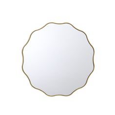 a round mirror with gold trim around it