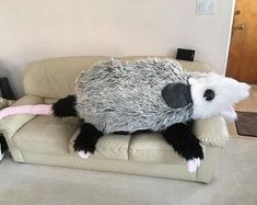 a stuffed animal that is sitting on a couch