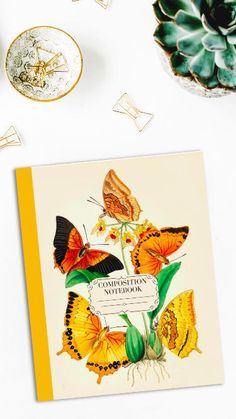 a greeting card with butterflies on it next to some other cards and flowers in vases