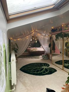 a bedroom decorated in green and white with lots of lights