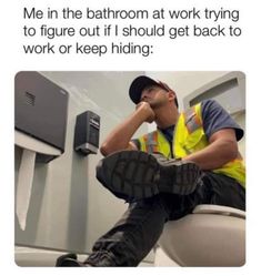 a man sitting on top of a toilet in a bathroom