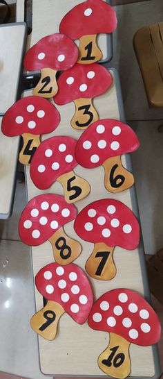 the numbers are placed on mushrooms to make them look like they're going down the hill