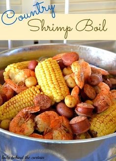 corn on the cob with sausage, potatoes and carrots in a pot ready to be cooked