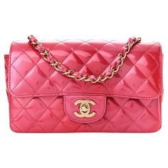 This bag is made out of luxurious diamond quilted iridescent patent leather in gradient pink. The bag features a crossbody leather threaded gold chain link shoulder strap, a frontal flap, and a gold Chanel CC turn lock. This opens to a pink interior with zipper and patch pockets. 23P A69900 B10234 Size XS Color: Pink Material: Patent leather Microchipped bag Item Code: C0****** Year: 2003 Height 5” x Length 7.75” x Depth 2.75” Drop: 11” (double strap) and 22” (single strap) Comes With: Dust bag Luxury Patent Leather Rectangular Shoulder Bag, Chanel Bag Pink, Chanel Classic Flap Bag Pink, Pink Chanel Flap Bag, Light Pink Chanel Bag, Luxury Pink Chain Bags, Gold Chanel, Leather Thread, Chanel Shoulder Bag