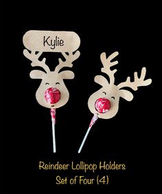 reindeer lollipop holders set of four on black background with name tag and candy