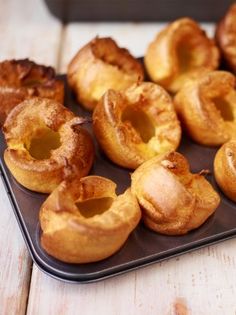 there are many doughnuts on the tray ready to be eaten